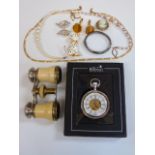 A pair of vintage opera glasses, some costume jewellery including a silver bangle