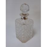 A square crystal decanter with a silver collar date marked Birmingham 1983