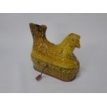 A Baldwin of USA tin plate egg laying Chicken toy