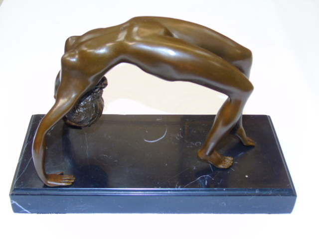 Bronze of a nude female figure in an arched bridge position.  Approx 6" tall including the base