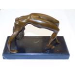 Bronze of a nude female figure in an arched bridge position.  Approx 6" tall including the base