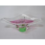 A Murano glass dish in pink, green and clear glass.