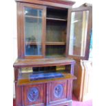 An Antique mahogany secretaire with carved decoration