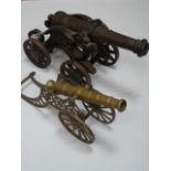 Victorian cast iron model of a cannon + a smaller brass example