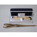 A pair of silver glove stretchers marked London 1902 and a boxed pair of Cross pens