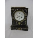 Inlaid emboised mantle clock.