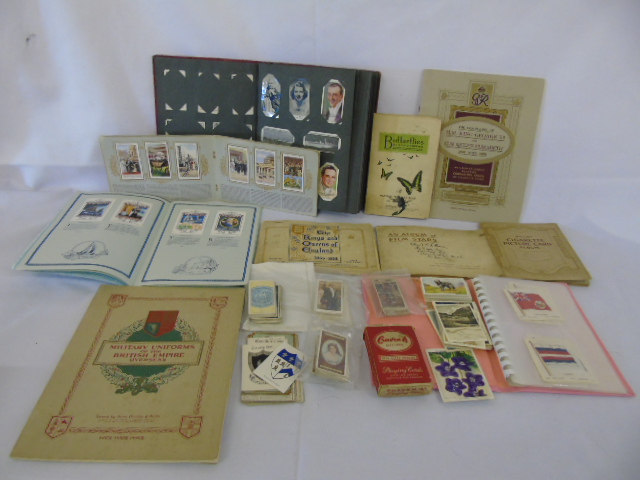 4 albums of cigarette cards and a almub to include silks