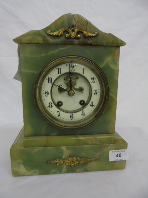 Onyx cased mantle clock approx 11" tall with open escapement.