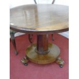 Victorian rosewood tiptop dining table on 3 claw feet with pedestal base