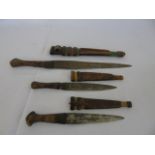 3 Leather handled tribal daggers with leather sheathes