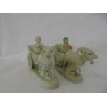 Pair of antique porcelain posy pots of cherubs in carts pulled by goats