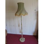 Brass and onyx standard lamp with green silk shade