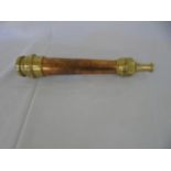 An antique copper and brass fireman's hose attachment stamped Merryweather London