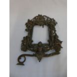 Cast metal bronzed photo frame depicting cherubs in classical poses approx 12" x 8"
