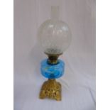 Blue glass oil lamp on guilded case metal base with etched shade and funnel