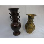 2 oriental bronze vases one dark bronze approx 13" high and the other lighter bronze approx 10" with