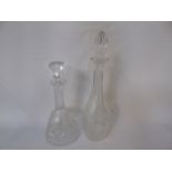 2 Cut glass decanters with stoppers 12" tall and 16" tall approx.