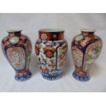 Pair of oriental decorated vases and a larger example all approx. 10" tall