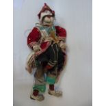 Carved wood oriental puppet in national dress with jointed hands