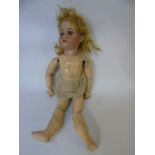 Antique wooden bodied porcelain headed doll marked Germany to the neck with closing eyes, open mouth