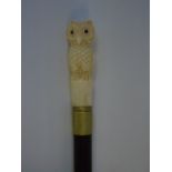 Carved bone top walking stick in the form of an owl