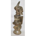 Songye standing fertility figure with it