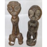 Two standing figures and two masks (4)