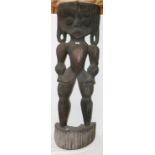 Large African standing wooden figure wit