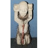 Carved African kneeling figure, Nkisi wi
