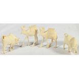 Four early 20th century carved ivory Afr