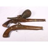 Two 20th century Arab made pistols, one flintlock, the other percussion cup, also a leather powder