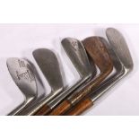 Five hickory shafted golf clubs includin