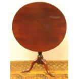 19th century circular mahogany snap-top table on turned pillar and tripod base, 76cm diameter.