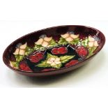 Moorcroft oval bowl decorated with cherries and flowers, no. 235, 23cm. Condition Report The colours