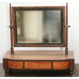 George III mahogany toilet mirror with three frieze drawers.