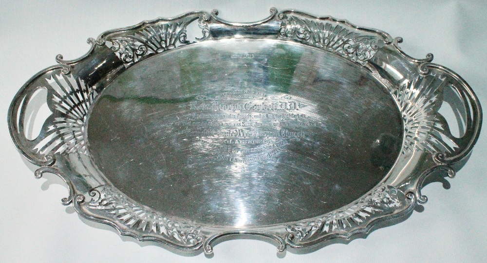 Victorian silver oval tray with pierced, scrolling border and handles, inscribed, 1899, 49.5cm,