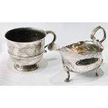 Silver cream boat with cut edge and scroll handle, 1766, and a christening cup, 1923, 7oz.  (2)