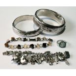 Two silver bangles, a similar charm bracelet and various other items.