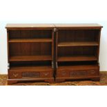 Pair of 20th century oak bookcases with base drawers, raised on bracket feet.