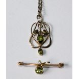 Gold pendant with two peridot and a similar bar brooch.   (2)