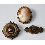 Gold brooch with boss centre, another, 9ct, 1889, and a cameo brooch.  (3)