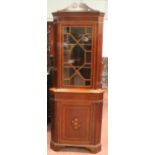 Edwardian mahogany and inlaid corner cabinet, the top section with astragal glazed doors above a
