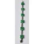 Jadeite bracelet with six pierced and carved square panels in white gold, 9ct;, c. 1920. Condition