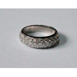 Ring of half-eternity style with three rows of diamond brilliants in 18ct white gold.