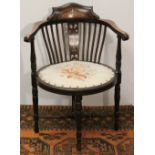 Edwardian mahogany and inlaid tub armchair with oval seat upholstered in tapestry, on turned legs