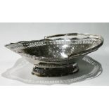 Georgian silver cake basket of waved, oval shape, pierced and engraved with pales, paterae and