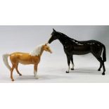 Beswick model of a Palomino and a Royal Doulton model of a horse.