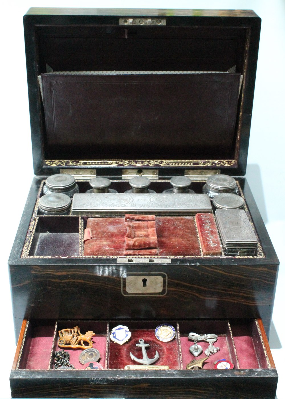 Victorian calamander wood dressing case with nine silver-mounted boxes and bottles, 1857, 30cm.