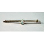 Gold pin with oval collet-set opal, probably 18ct gold. Condition Report 2.6g