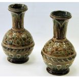 Pair of Doulton Lambeth stoneware baluster vases by Rosina Harris with stylised clover decoration,